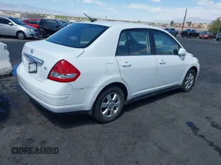 2007 Nissan Versa 1.8 S with VIN 3N1BC11E47L439072, listed as a IAAI auction lot 42083801 with 215,096 mi miles. Bid and sale history available at carsss.com. Image 4.