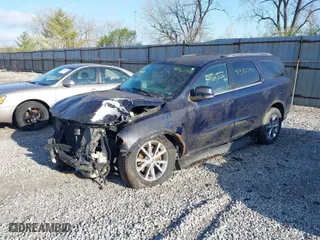 2014 Dodge Durango Limited with VIN 1C4RDJDG0EC428357, listed as a IAAI auction lot 41982340 with 62,910 mi miles. Bid and sale history available at carsss.com. Image 2.