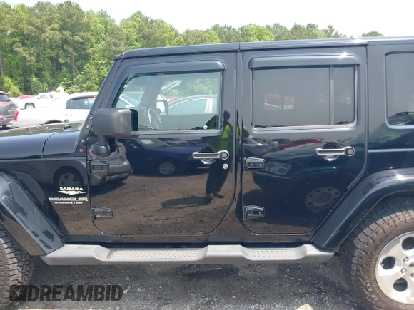 2014 Jeep Wrangler Unlimited Sahara with VIN 1C4BJWEG0EL273086, listed as a IAAI auction lot 42340938 with 121,448 mi miles and . Bid and sale history available at DreamBid. Image 14.