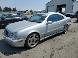 2000 Mercedes-Benz CLK 320/430 with VIN WDBLJ70G9YF144900, listed as a Copart auction lot 65674994 with 217,318 mi miles and Salvage Title. Bid and sale history available at DreamBid. Image 1.