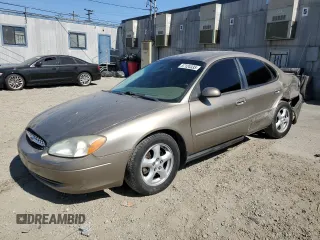 2003 Ford Taurus SES Standard z VIN 1FAFP55253G138373, wystawiony jako Copart lot #57124335 z przebiegiem 89 136 mil mil oraz Szkoda całkowita • Salvage title. Historia ofert i sprzedaży dostępna na DreamBid. Obrazek 1.