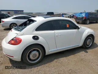 2013 Volkswagen Beetle with VIN 3VWHX7AT2DM656457, listed as a Copart auction lot 63814944 with 92,966 mi miles and Salvage Title. Bid and sale history available at DreamBid. Image 3.