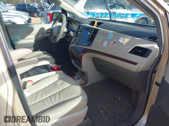 2011 Toyota Sienna XLE AAS with VIN 5TDYK3DCXBS117023, listed as a IAAI auction lot 41581785 with 216,341 mi miles. Bid and sale history available at carsss.com. Image 5.
