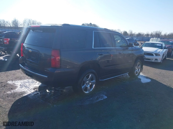 2018 Chevrolet Tahoe Premier with VIN 1GNSCCKC5JR204676, listed as a IAAI auction lot 41731192 with 130,528 mi miles. Bid and sale history available at carsss.com. Image 4.