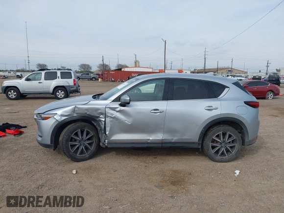 2017 Mazda CX-5 Grand Touring with VIN JM3KFBDL8H0227348, listed as a IAAI auction lot 41572377 with 124,908 mi miles. Bid and sale history available at carsss.com. Image 14.