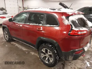2015 Jeep Cherokee Trailhawk with VIN 1C4PJMBS2FW609999, listed as a IAAI auction lot 41582536 with 133,666 mi miles. Bid and sale history available at carsss.com. Image 3.
