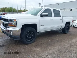2018 Chevrolet Silverado 1500 LT with VIN 3GCPCREC7JG402401, listed as a IAAI auction lot 41880462 with 128,995 mi miles and . Bid and sale history available at DreamBid. Image 21.