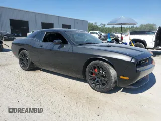 2014 Dodge Challenger R/T z VIN 2C3CDYBT6EH112199, wystawiony jako Copart lot #58023535 z przebiegiem 99 977 mil mil oraz Szkody całkowita. Historia ofert i sprzedaży dostępna na DreamBid. Obrazek 4.