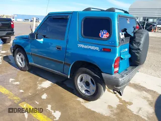 1997 Chevrolet Tracker z VIN 2CNBE1865V6904672, wystawiony jako IAAI lot #41296166 z przebiegiem 266 743 mil mil oraz . Historia ofert i sprzedaży dostępna na DreamBid. Obrazek 3.