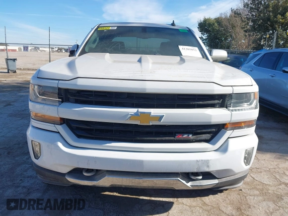 2017 Chevrolet Silverado 1500 LT with VIN 3GCUKREC4HG466329, listed as a IAAI auction lot 41305052 with 57,844 mi miles and . Bid and sale history available at DreamBid. Image 6.