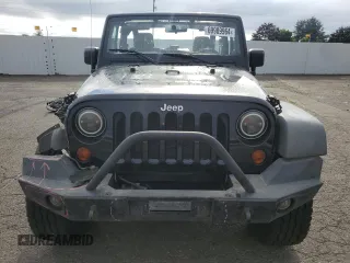 2011 Jeep Wrangler Rubicon with VIN 1J4BA6D12BL507652, listed as a Copart auction lot 69989964 with 127,493 mi miles and Salvage title. Bid and sale history available at DreamBid. Image 5.