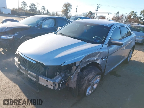 2014 Ford Taurus SEL z VIN 1FAHP2E87EG121069, wystawiony jako IAAI lot #41030422 z przebiegiem 138 043 mil mil oraz . Historia ofert i sprzedaży dostępna na DreamBid. Obrazek 17.