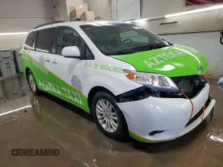 2015 Toyota Sienna XLE с VIN 5TDYK3DC9FS601304, выставлен на аукционе Copart как лот 51118295 с пробегом 153 121 миль миль и Списание • Salvage title. История ставок и продаж доступна на DreamBid. Изображение 4.