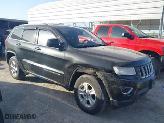 2014 Jeep Grand Cherokee Laredo with VIN 1C4RJEAG4EC136764, listed as a IAAI auction lot 41817676 with 133,943 mi miles. Bid and sale history available at carsss.com. Image 1.
