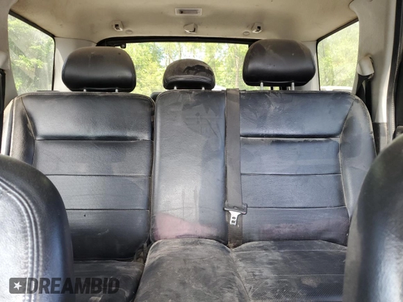 2005 Ford Escape Limited with VIN 1FMYU041X5KC72704, listed as a Copart auction lot 57819655 with 179,469 mi miles and Salvage title. Bid and sale history available at DreamBid. Image 10.