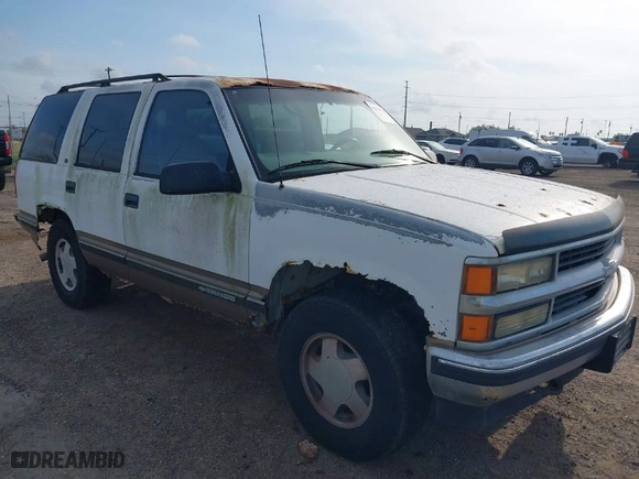 1997 Chevrolet Tahoe with VIN 1GNEK13R3VJ416827, listed as a IAAI auction lot 42041780 with 143,566 mi miles. Bid and sale history available at carsss.com. Image 1.
