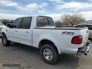2001 Ford F-150 SuperCrew XLT with VIN 1FTRW08L51KB76553, listed as a Copart auction lot 75202514 with 324,064 mi miles and Salvage Title. Bid and sale history available at carsss.com. Image 2.