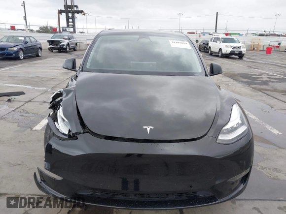 2022 Tesla Model Y Long Range z VIN 7SAYGDEE0NF508958, wystawiony jako IAAI lot #42191819 z przebiegiem 60 880 mil mil oraz . Historia ofert i sprzedaży dostępna na DreamBid. Obrazek 12.