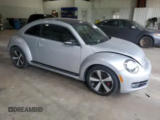 2012 Volkswagen Beetle with VIN 3VWV67AT1CM663839, listed as a Copart auction lot 55009455 with 122,042 mi miles and Salvage Title. Bid and sale history available at DreamBid. Image 4.