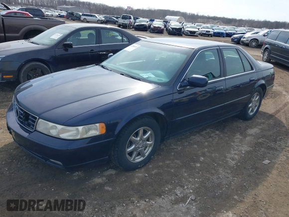 1999 Cadillac Seville Touring STS z VIN 1G6KY5493XU913994, wystawiony jako IAAI lot #41780695 z przebiegiem 60 375 mil mil oraz . Historia ofert i sprzedaży dostępna na DreamBid. Obrazek 2.