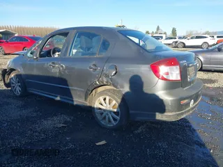 2010 Suzuki SX4 with VIN JS2YC5A40A6300053, listed as a IAAI auction lot 41392061 with 114,863 mi miles and . Bid and sale history available at DreamBid. Image 3.