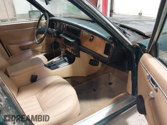 1985 Jaguar XJ with VIN SAJAV1347FC414864, listed as a IAAI auction lot 42118511 with 117,185 mi miles and . Bid and sale history available at DreamBid. Image 5.