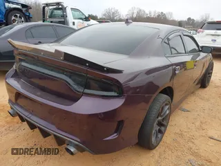 2021 Dodge Charger Scat Pack Widebody with VIN 2C3CDXGJ5MH579324, listed as a IAAI auction lot 41399676 with 77,156 mi miles and . Bid and sale history available at DreamBid. Image 4.