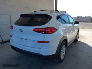 2021 Hyundai Tucson Value with VIN KM8J33A45MU316051, listed as a IAAI auction lot 41692349 with 59,096 mi miles. Bid and sale history available at carsss.com. Image 4.