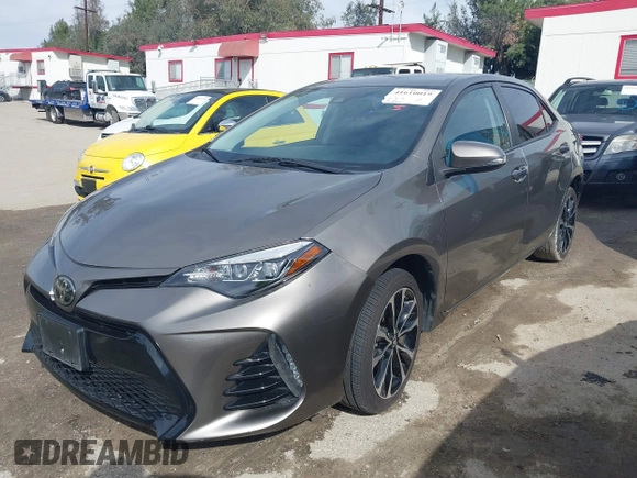 2017 Toyota Corolla L z VIN 5YFBURHE5HP730912, wystawiony jako IAAI lot #41610019 z przebiegiem 61 440 mil mil oraz . Historia ofert i sprzedaży dostępna na DreamBid. Obrazek 2.