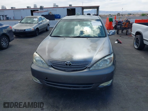 2003 Toyota Camry LE with VIN JTDBE32K130149032, listed as a IAAI auction lot 42063174 with 241,424 mi miles and . Bid and sale history available at DreamBid. Image 6.