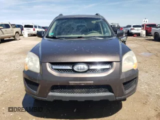 2009 Kia Sportage LX with VIN KNDJF724697568334, listed as a Copart auction lot 54056605 with 252,049 mi miles and Clean Title. Bid and sale history available at carsss.com. Image 5.