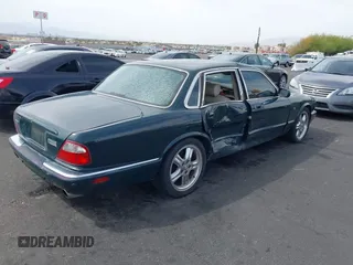 2003 Jaguar XJ with VIN SAJDA15B73MF53499, listed as a IAAI auction lot 41896445 with 95,055 mi miles and . Bid and sale history available at DreamBid. Image 4.