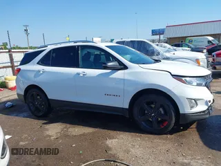 2021 Chevrolet Equinox Premier z VIN 2GNAXNEV9M6120241, wystawiony jako IAAI lot #42222928 z przebiegiem 104 274 mil mil oraz . Historia ofert i sprzedaży dostępna na DreamBid. Obrazek 14.