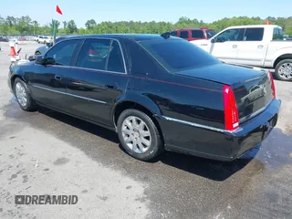 2011 Cadillac DTS Premium Collection z VIN 1G6KH5E65BU140314, wystawiony jako IAAI lot #42050040 z przebiegiem 149 921 mil mil oraz . Historia ofert i sprzedaży dostępna na DreamBid. Obrazek 3.