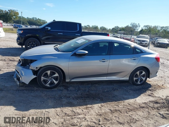 2020 Honda Civic LX with VIN 19XFC2F62LE009433, listed as a IAAI auction lot 40963670 with 117,865 mi miles and . Bid and sale history available at DreamBid. Image 14.