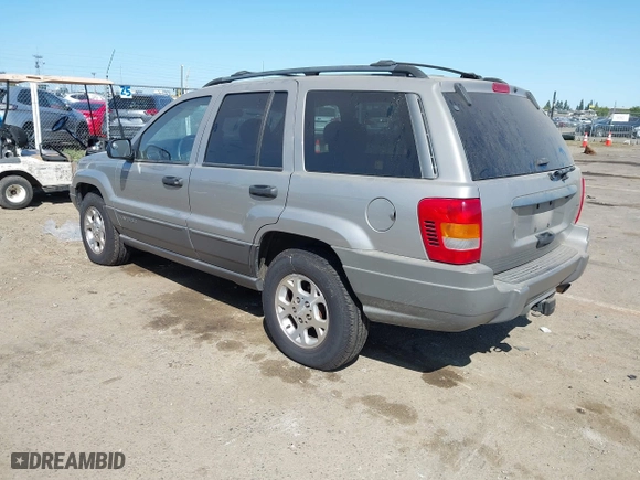 2001 Jeep Grand Cherokee Laredo with VIN 1J4GW48S61C662315, listed as a IAAI auction lot 42002235 with 166,901 mi miles. Bid and sale history available at carsss.com. Image 3.