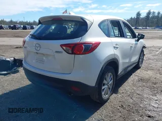 2016 Mazda CX-5 Sport with VIN JM3KE2BY9G0887110, listed as a IAAI auction lot 41761039 with 86,624 mi miles. Bid and sale history available at carsss.com. Image 4.