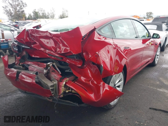 2021 Tesla Model 3 Long Range with VIN 5YJ3E1EB3MF862392, listed as a IAAI auction lot 41765987 with 51,915 mi miles and . Bid and sale history available at DreamBid. Image 4.
