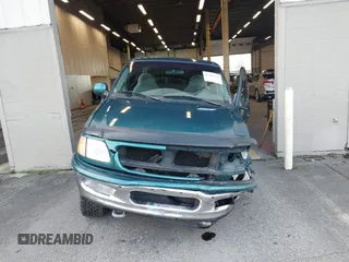 1997 Ford F-150 XL with VIN 1FTEX18L1VKB44867, listed as a IAAI auction lot 41266572 with 105,061 mi miles. Bid and sale history available at carsss.com. Image 12.