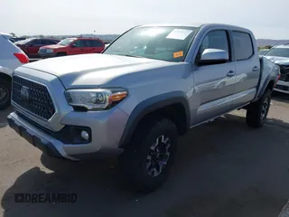 2018 Toyota Tacoma SR5 with VIN 3TMAZ5CN0JM053861, listed as a IAAI auction lot 41920377 with 104,015 mi miles and . Bid and sale history available at DreamBid. Image 17.