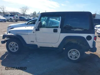 2004 Jeep Wrangler Sport Right Hand Drive with VIN 1J4F449SX4P780560, listed as a IAAI auction lot 41645721 with 146,681 mi miles. Bid and sale history available at carsss.com. Image 13.