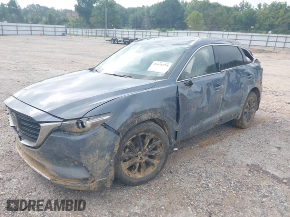 2021 Mazda CX-9 Grand Touring with VIN JM3TCADY2M0509286, listed as a IAAI auction lot 39976279 with 93,588 mi miles and . Bid and sale history available at DreamBid. Image 2.