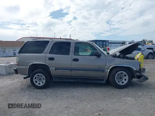 2002 Chevrolet Tahoe LS z VIN 1GNEC13Z72R258244, wystawiony jako IAAI lot #42639069 z przebiegiem Nie podano mil oraz . Historia ofert i sprzedaży dostępna na DreamBid. Obrazek 13.
