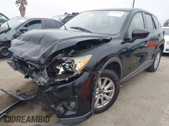 2014 Mazda CX-5 Touring z VIN JM3KE2CY3E0355332, wystawiony jako IAAI lot #42096306 z przebiegiem 108 198 mil mil oraz . Historia ofert i sprzedaży dostępna na DreamBid. Obrazek 2.