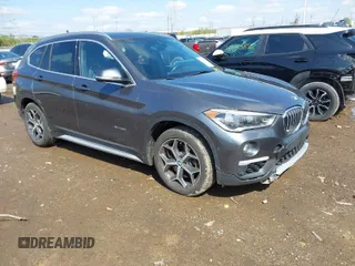 2016 BMW X1 xDrive28i with VIN WBXHT3C35GP886094, listed as a IAAI auction lot 42009639 with 61,739 mi miles. Bid and sale history available at carsss.com. Image 1.