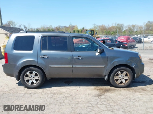2011 Honda Pilot Touring with VIN 5FNYF4H94BB035415, listed as a IAAI auction lot 42126738 with 239,273 mi miles. Bid and sale history available at carsss.com. Image 13.