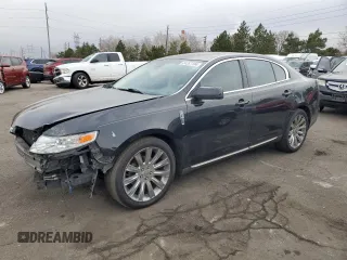 2011 Lincoln MKS EcoBoost with VIN 1LNHL9FT0BG606856, listed as a Copart auction lot 84287104 with 128,268 mi miles and Salvage Title. Bid and sale history available at DreamBid. Image 1.
