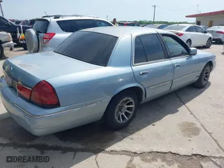 2002 Mercury Grand Marquis LS Premium with VIN 2MEFM75W32X626469, listed as a IAAI auction lot 42015115 with 111,952 mi miles. Bid and sale history available at carsss.com. Image 4.