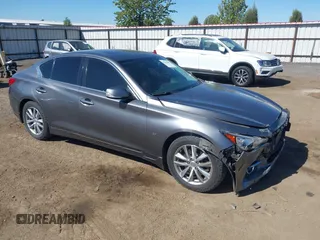 2015 Infiniti Q50 Premium z VIN JN1BV7AR1FM412559, wystawiony jako IAAI lot #42201482 z przebiegiem 115 982 mil mil oraz . Historia ofert i sprzedaży dostępna na DreamBid. Obrazek 1.