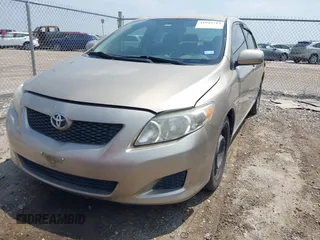 2009 Toyota Corolla with VIN 1NXBU40E69Z002692, listed as a IAAI auction lot 41942713 with 127,609 mi miles. Bid and sale history available at carsss.com. Image 2.